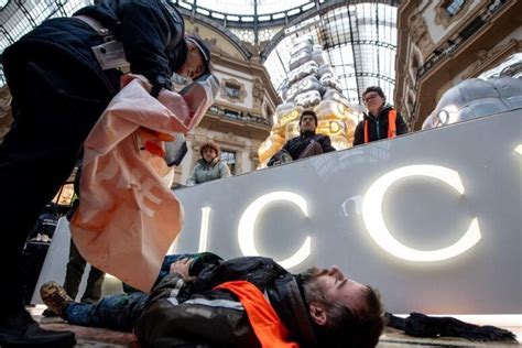 gucci xmas tree milano|Activists Throw Orange Paint on Gucci Christmas Tree in Milan.